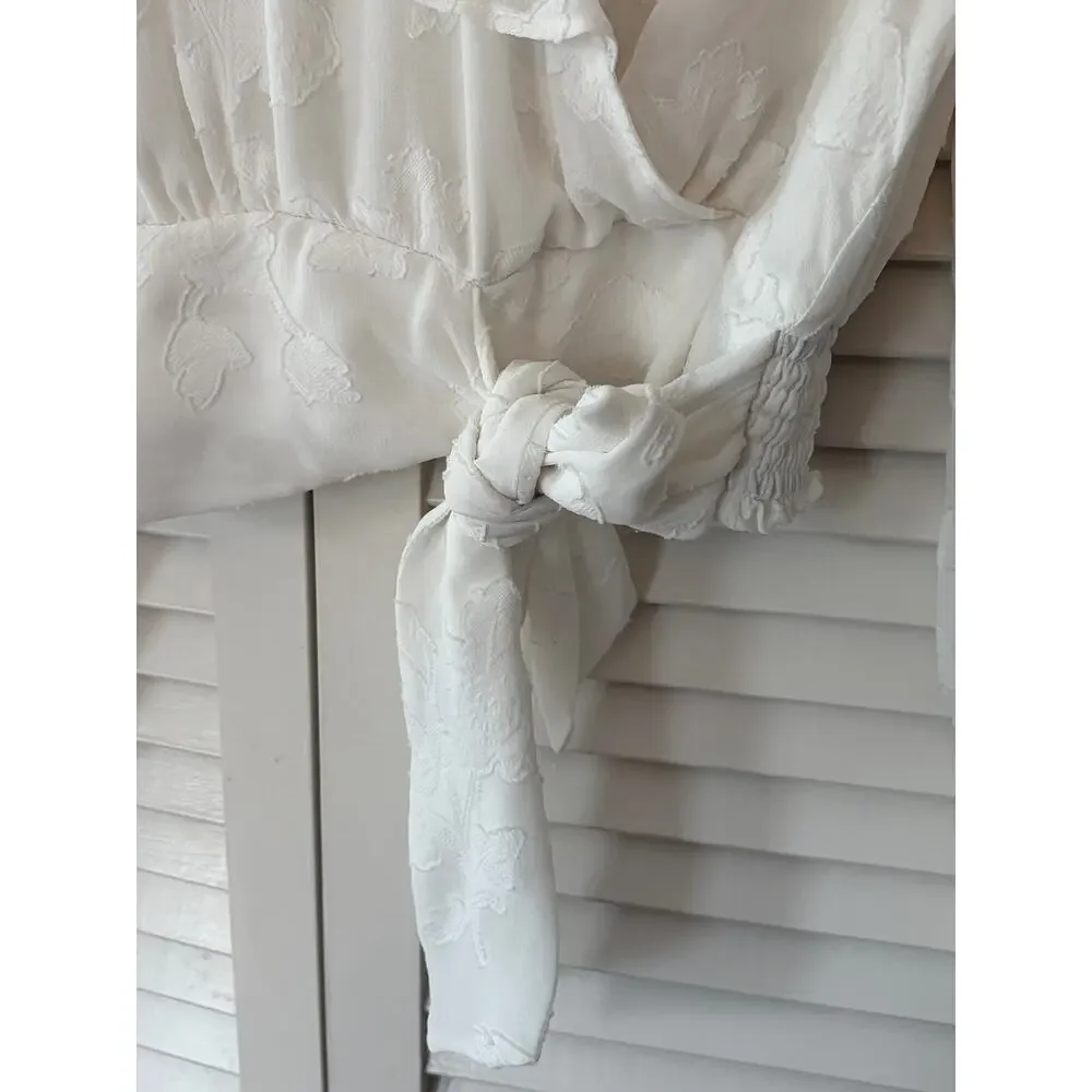 By Anthropologie Milena Burnout Velvet Wrap Blouse white ruffle cottagecore